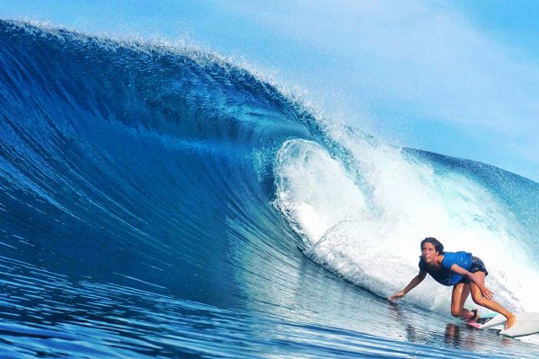 Surfing Girl on best surfspot of Simeulue Island