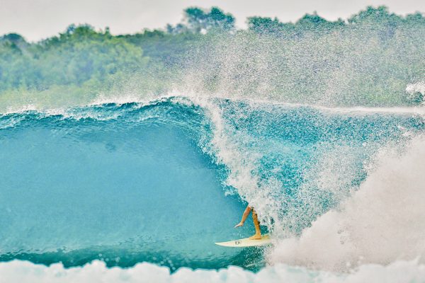 Man surfing during surf trip Simeulue Island